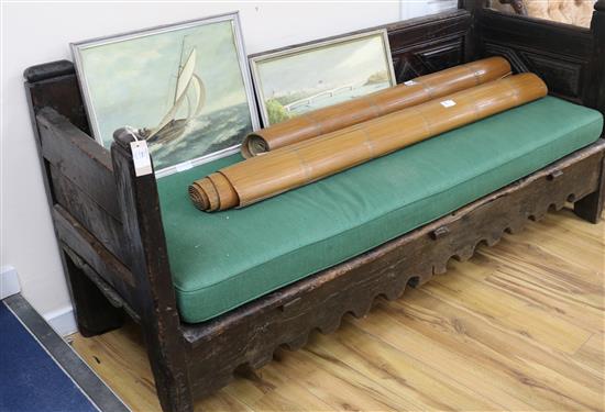 A 17th century Spanish chestnut settle, W.6ft 3in. D.2ft 4in. H.2ft 11in.